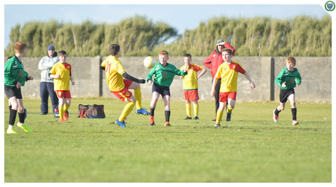 John O'Brien competes for a ball in the U12 game between Sporting Ennistymon Football Club and Avenue United Football Club. Game played in Lahinch Sportsfield on the 11th of June 2019.