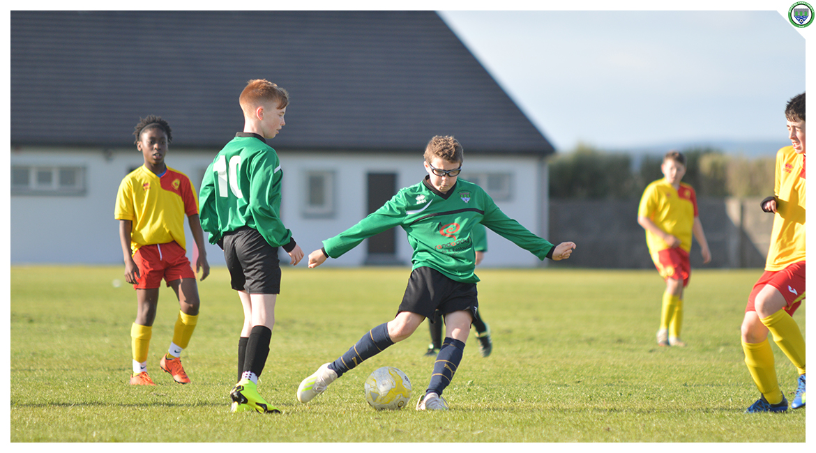 Cian Griffin shoots towards goal in the U12 game between Sporting Ennistymon Football Club and Avenue United Football Club. Game played in Lahinch Sportsfield on the 11th of June 2019.
