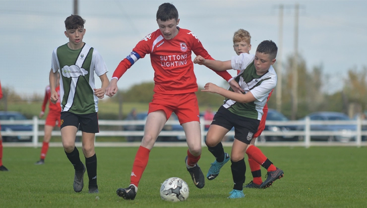 Daniel Brody battles for possession against a Lifford player in the U13 Division 2 cup