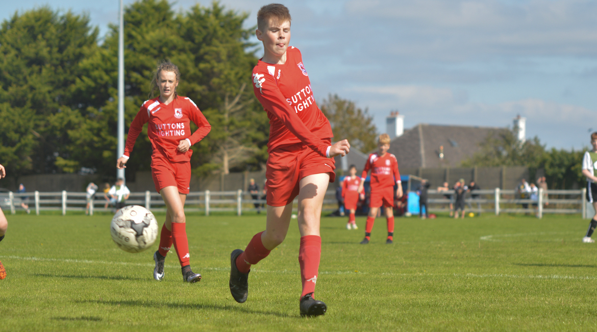 A Lifford AFC player clears the ball over the sideline in the U13 Division 2 Cup Final between Sporting Ennistymon F.C and Lifford A.F.C in Frank Healy Park.