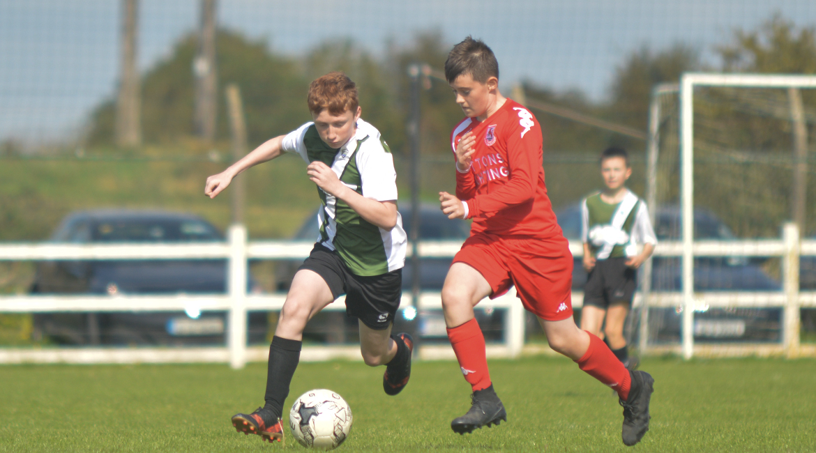 John O'Brien challenges for possesion against his Lifford AFC counterpart in the U13 Division 2 Cup Final between Sporting Ennistymon F.C and Lifford A.F.C in Frank Healy Park.