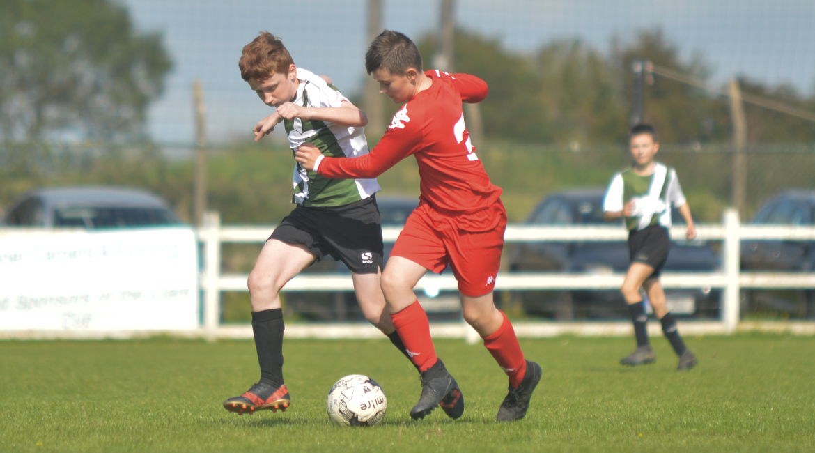 John O'Brien challenges for possesion against his Lifford AFC counterpart in the U13 Division 2 Cup Final between Sporting Ennistymon F.C and Lifford A.F.C in Frank Healy Park.