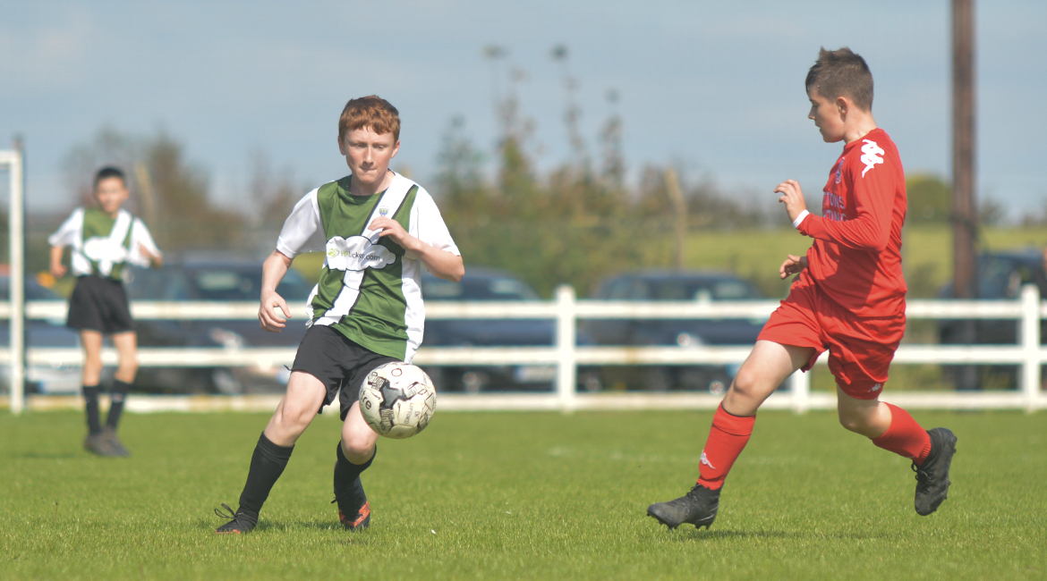 John O'Brien plays a pass in the U13 Division 2 Cup Final between Sporting Ennistymon F.C and Lifford A.F.C in Frank Healy Park.