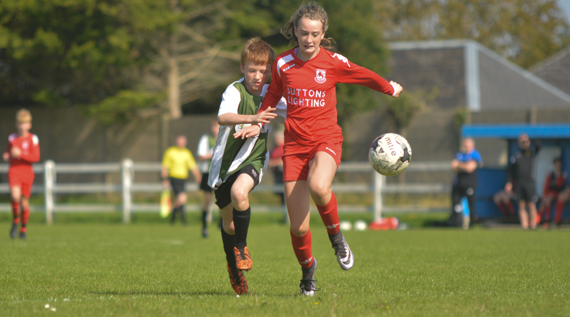 Darren O'Brien challenges for possession in the U13 Division 2 Cup Final between Sporting Ennistymon F.C and Lifford A.F.C in Frank Healy Park.