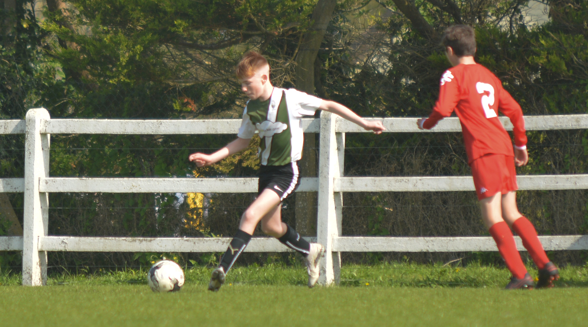 Eoin Devanney plays a cross field ball in the U13 Division 2 Cup Final between Sporting Ennistymon F.C and Lifford A.F.C in Frank Healy Park.