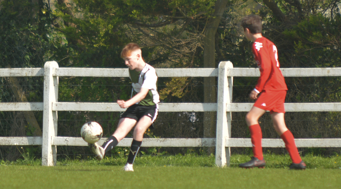 Eoin Devanney plays a cross field ball in the U13 Division 2 Cup Final between Sporting Ennistymon F.C and Lifford A.F.C in Frank Healy Park.