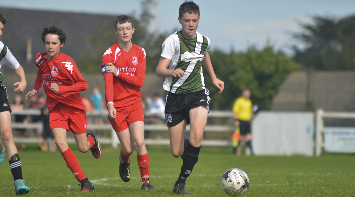 Jack Gallagher in possession during the U13 Division 2 Cup Final between Sporting Ennistymon F.C and Lifford A.F.C in Frank Healy Park.