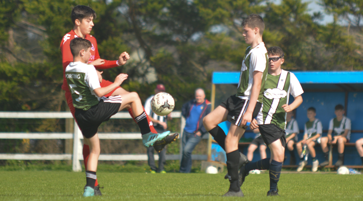 Louis Griffin, Jack Gallagher and a Lifford AFC player challenge for possession during the U13 Division 2 Cup Final between Sporting Ennistymon F.C and Lifford A.F.C in Frank Healy Park.