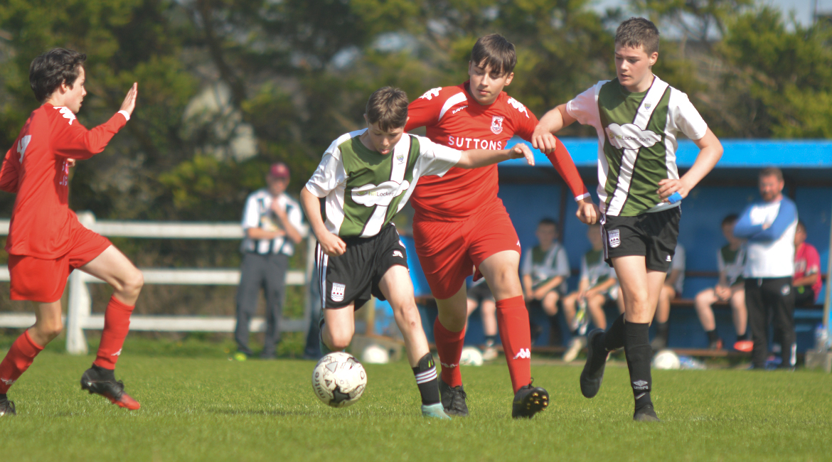 Louis Griffin looks to clear the ball during the U13 Division 2 Cup Final between Sporting Ennistymon F.C and Lifford A.F.C in Frank Healy Park.