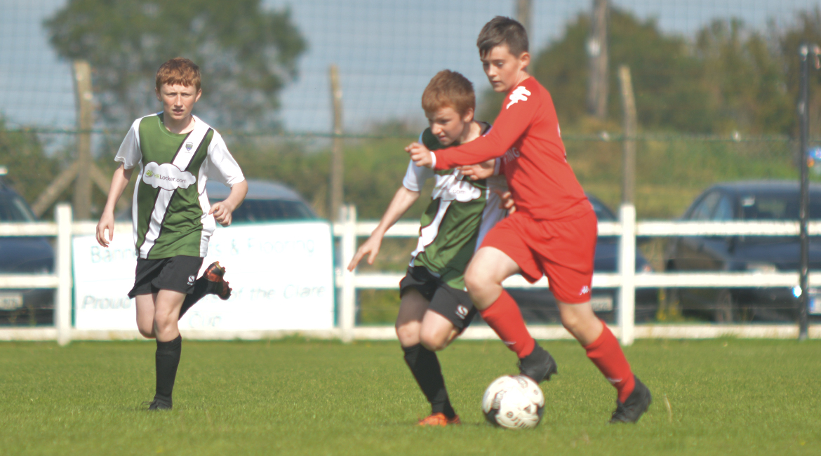 Darren O'Brien challenges for possesion against his Lifford AFC counterpart in the U13 Division 2 Cup Final between Sporting Ennistymon F.C and Lifford A.F.C in Frank Healy Park.